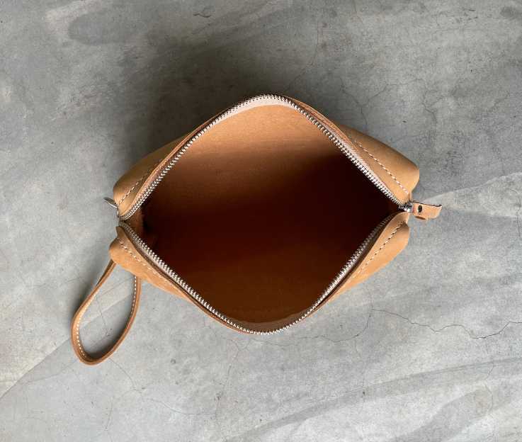 inside view of the luxury leather toiletry bag lined with a light suede.